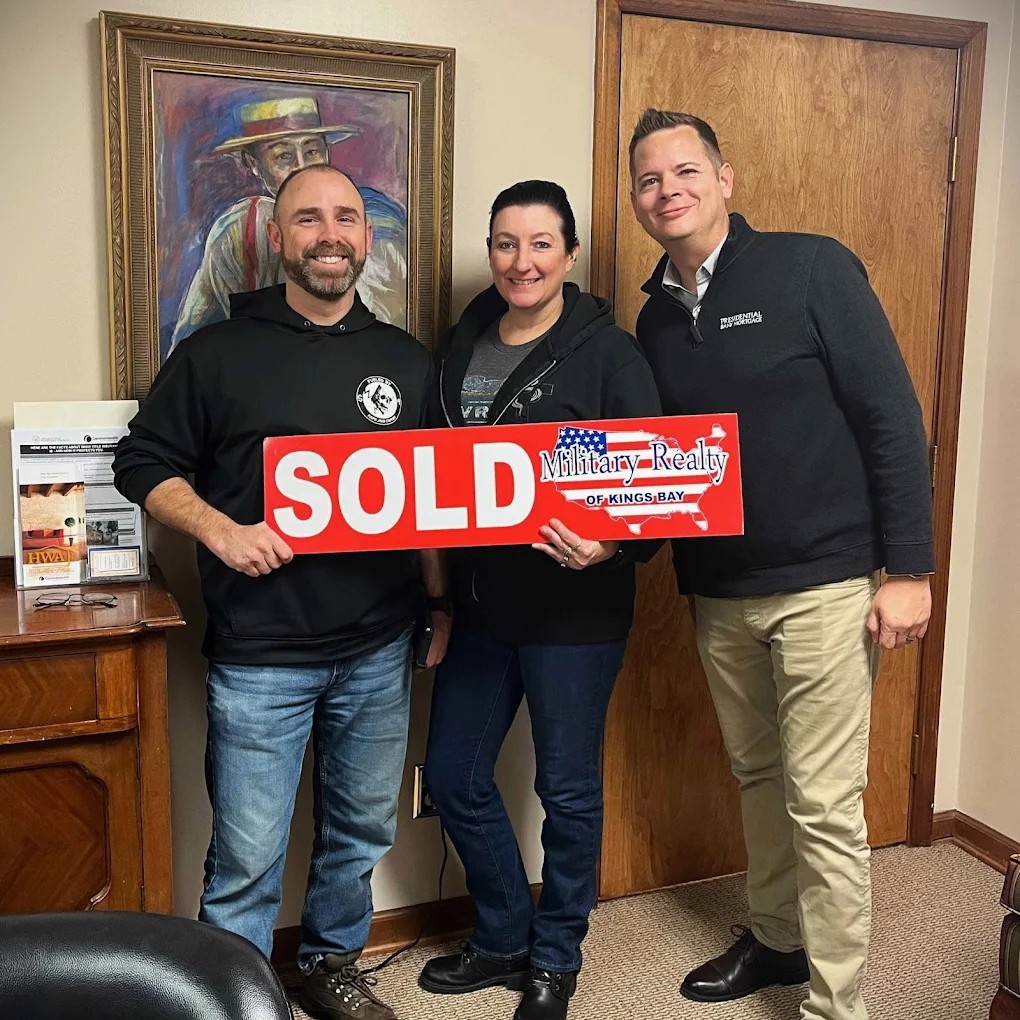 Happy VA homebuyers celebrating successful closing with Mitch Blyler in Camden County