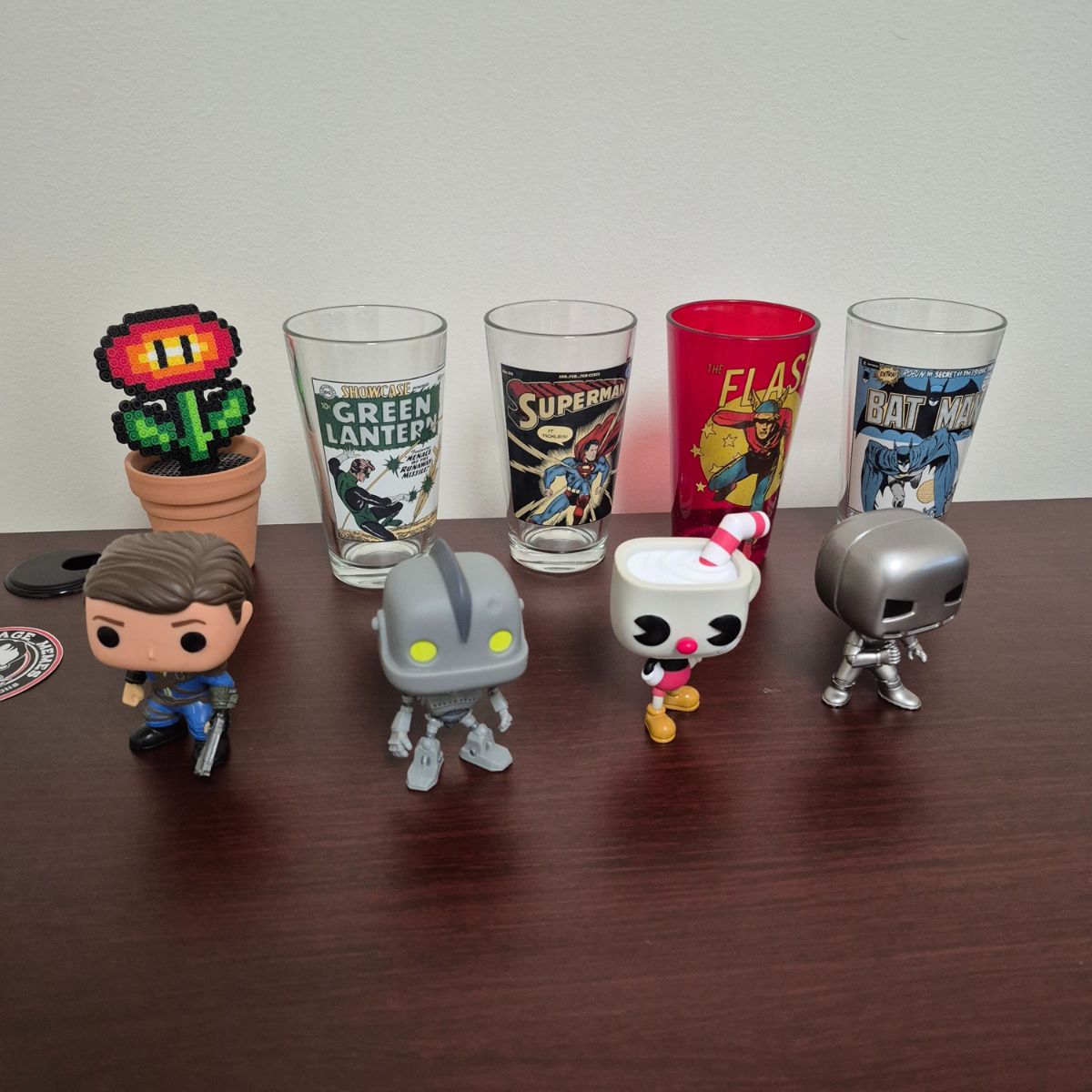 Collection of Funko Pop figures in Mitch's office